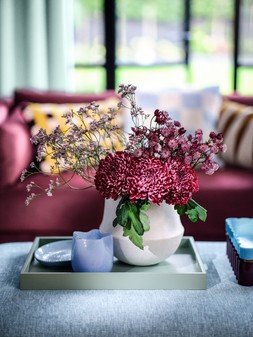 The Strand 3 Seater Matt Velvet Wine All Over, £599. The Newbury Bench Footstool in The Newbury Linen Look Chenille Sky All Over, £399.